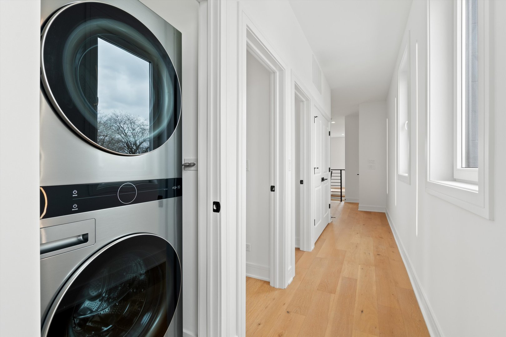 4920 North Whipple Street, Unit 2 Chicago, IL 60625 - Photo 15 of 16 a view of a hallway with washer and dryer