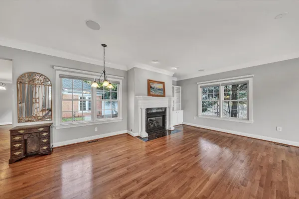 a view of a room with wooden floor and window