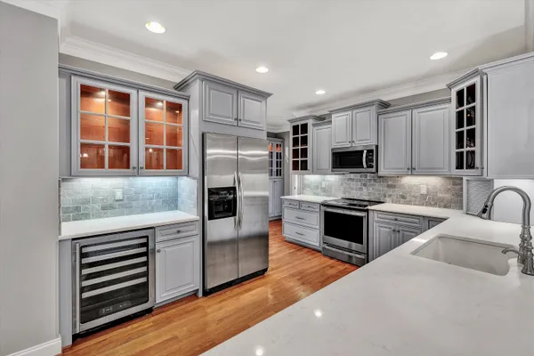 a kitchen with stainless steel appliances granite countertop a stove and a microwave