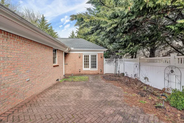a view of a house with a yard and garage