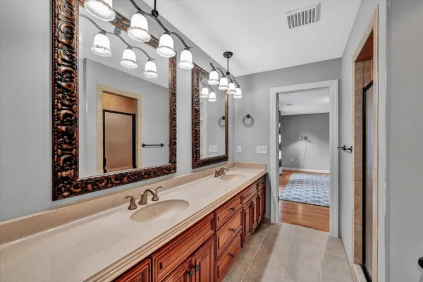 a bathroom with a glass shower door