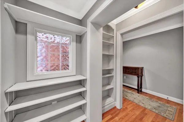 a view of room with a window and wooden floor