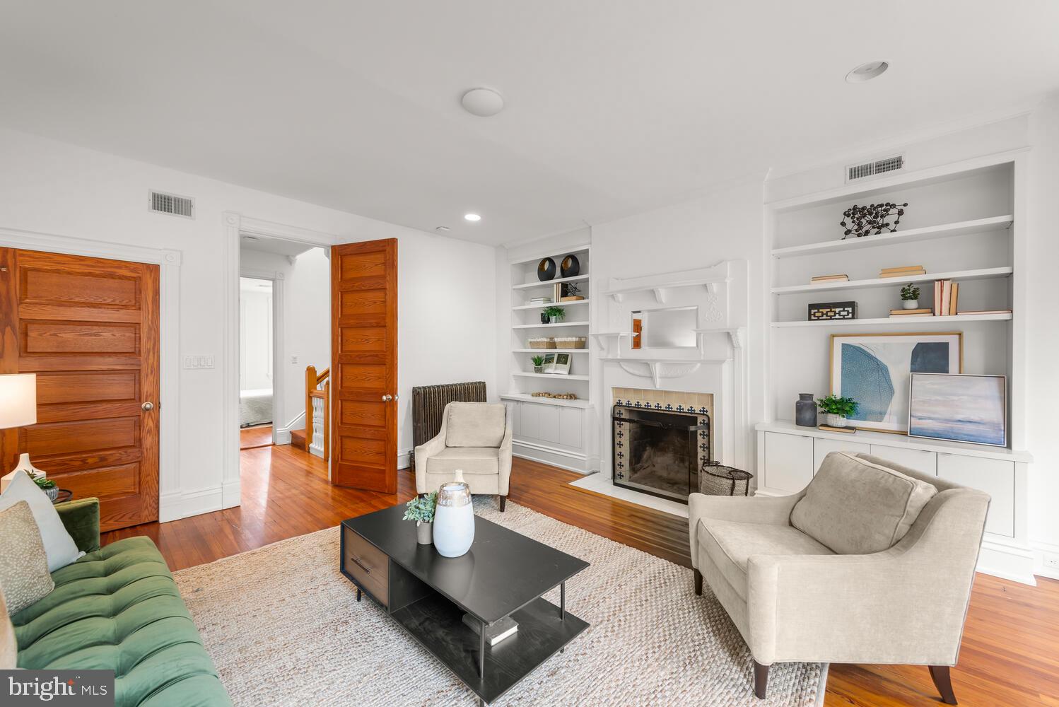1607 S Street Northwest Washington, DC 20009 - Photo 34 of 75 Floor to ceiling bookcases and fireplace