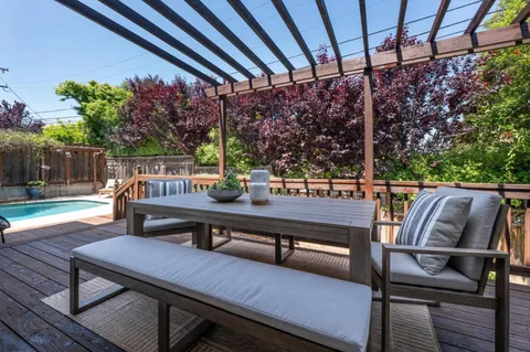 a view of a outdoor sitting area with furniture