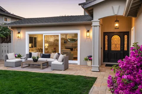 a front view of house with an outdoor seating