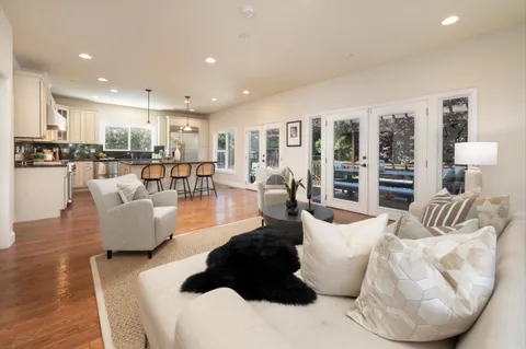 a large living room with furniture and a large window