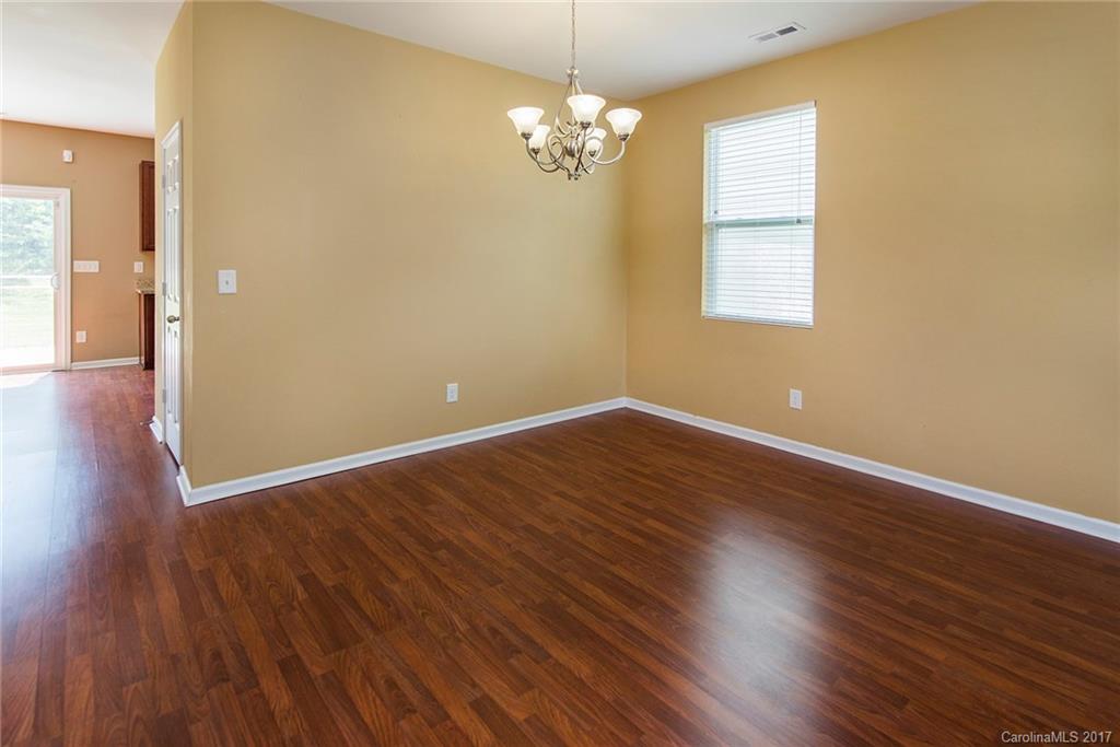 11824 Bending Branch Road Charlotte, NC 28227 - Photo 11 of 23 a view of a room with wooden floor and windows