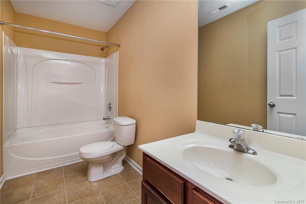 11824 Bending Branch Road Charlotte, NC 28227 - Photo 20 of 23 a bathroom with a sink a toilet and shower