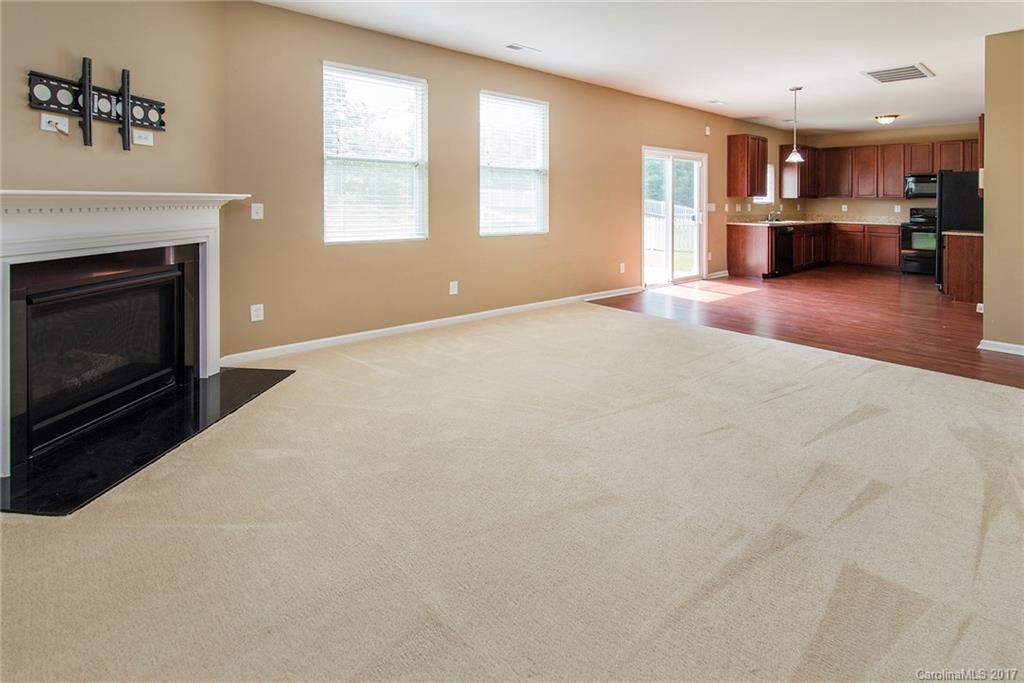 11824 Bending Branch Road Charlotte, NC 28227 - Photo 3 of 23 a big room with windows and a fireplace