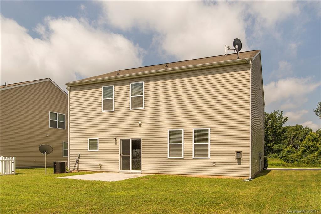 11824 Bending Branch Road Charlotte, NC 28227 - Photo 21 of 23 a front view of a house with a yard