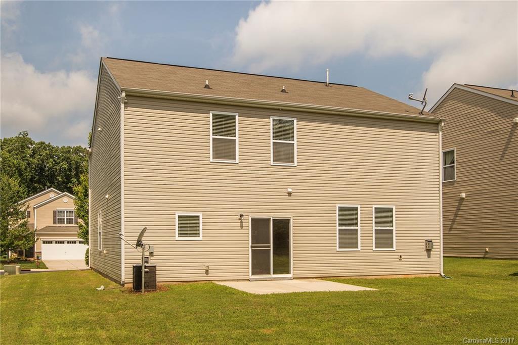 11824 Bending Branch Road Charlotte, NC 28227 - Photo 22 of 23 a front view of a house with a yard