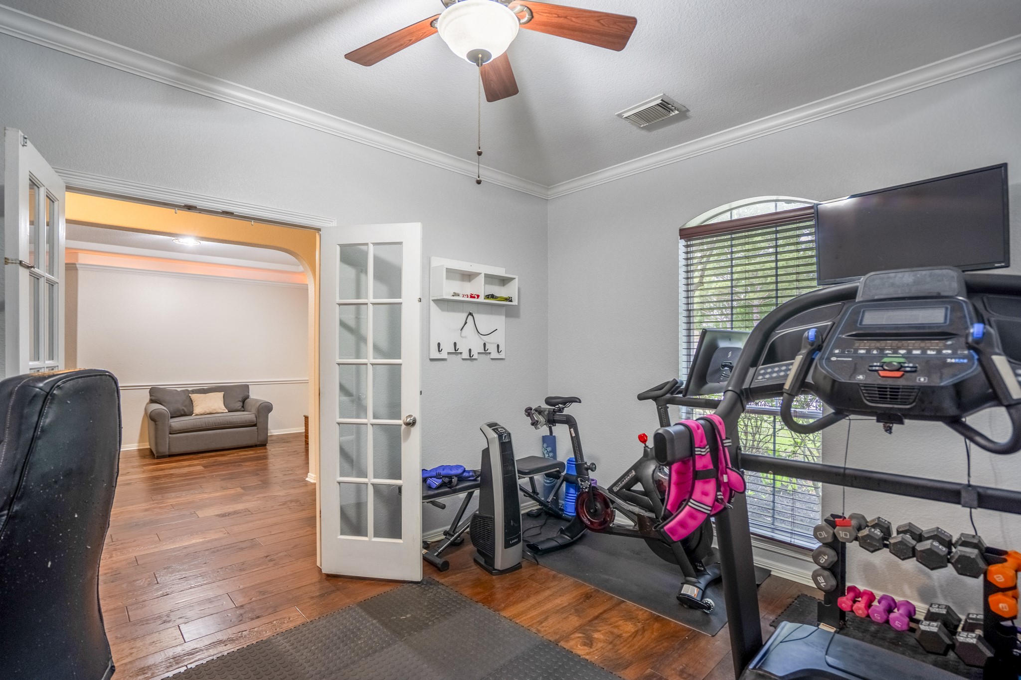 10410 Pitcataway Drive Spring, TX 77379 - Photo 7 of 48 From the home office you have access to a large window that streams in light and allows you to greet guests and see nature beyond.