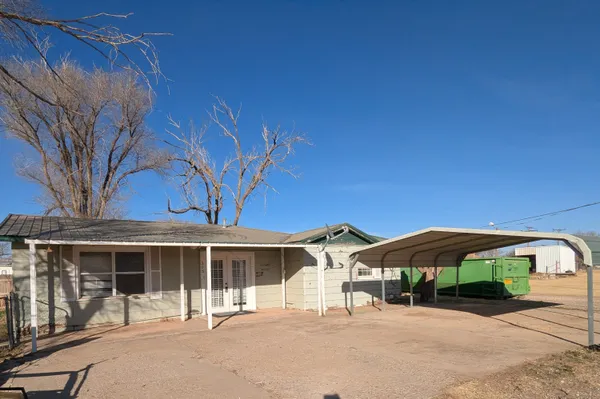 a front view of a house with yard and porch