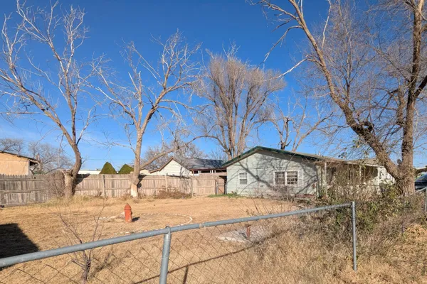 a view of a backyard of the house