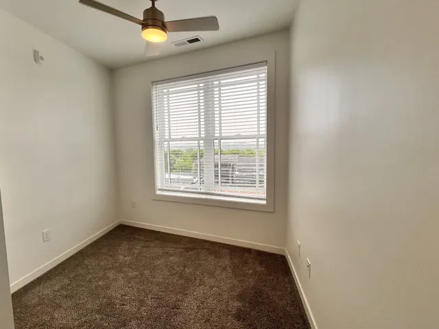 a bathroom with a double vanity sink toilet mirror and bathtub