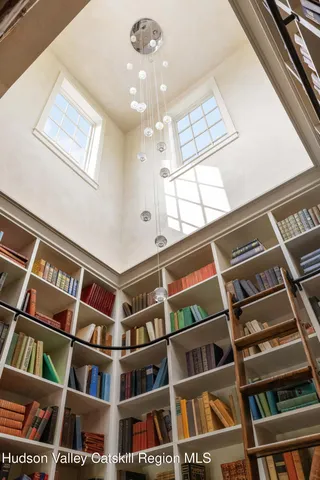 a bathroom with a sink a mirror and a shower