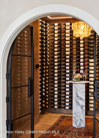 a spacious bathroom with a double vanity sink a mirror a bathtub and a shower