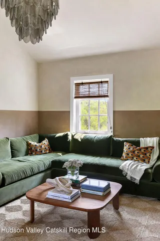 a view of a dining room with furniture and window