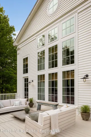 a room with lots of furniture and windows