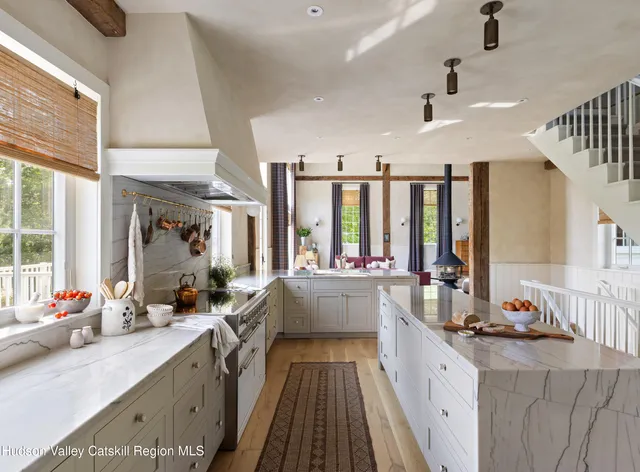 a view of a patio with table and chairs with wooden floor