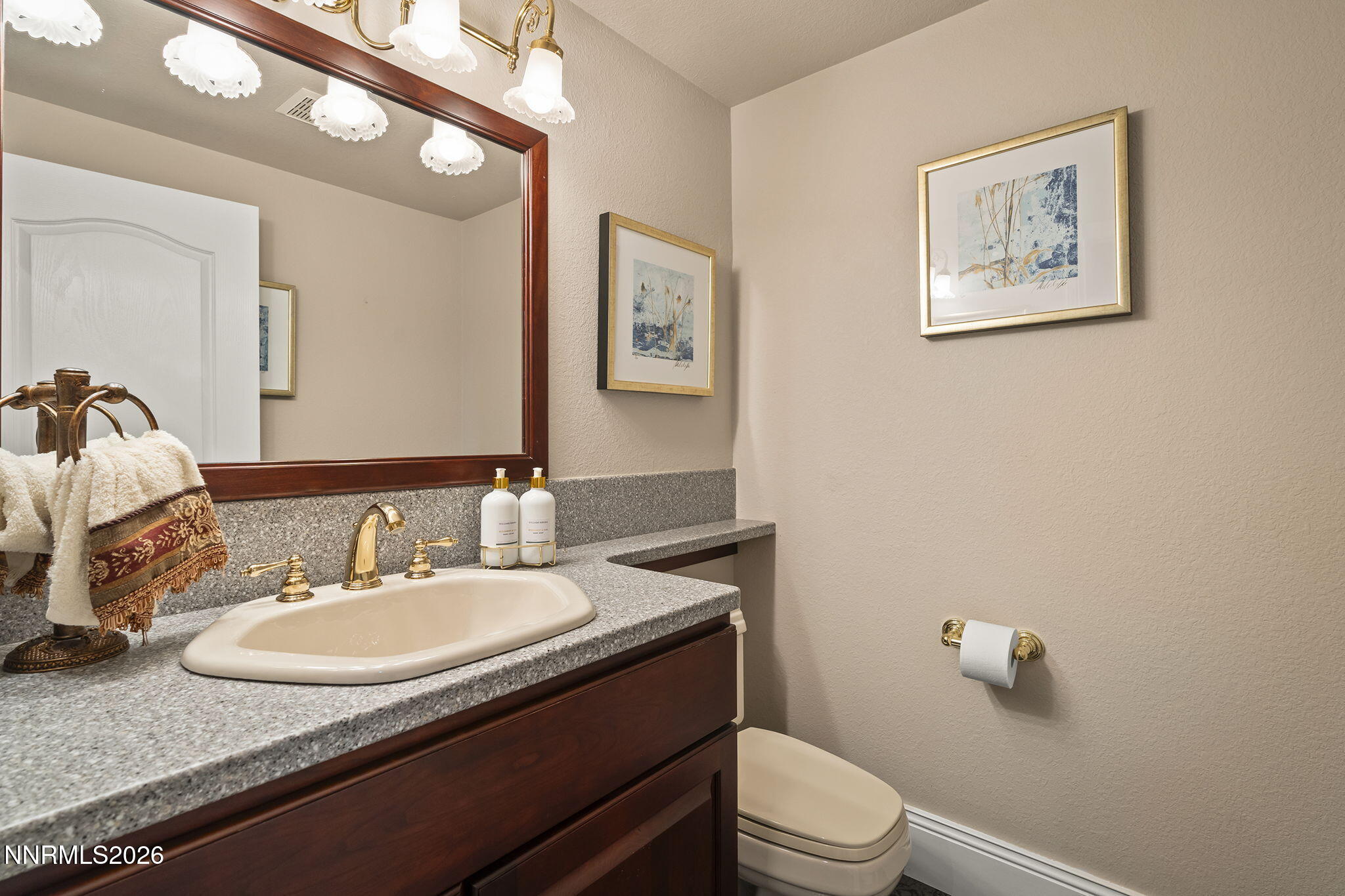 30 Francovich Court Reno, NV 89519 - Photo 39 of 79 a bathroom with a granite countertop sink and a mirror with toilet