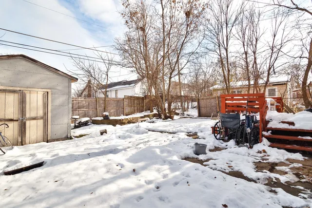 a view of a yard covered in snow