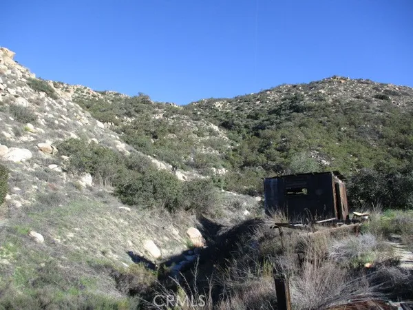 a view of a town with mountains in the background