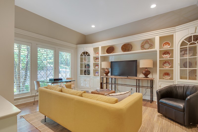 388 South Shady Grove Road Memphis, TN 38120 - Photo 16 of 25 A view of the Den. Located on the front of the home and just off the Entry. Note those beautiful diamond-patterned windows and plantation shutters.