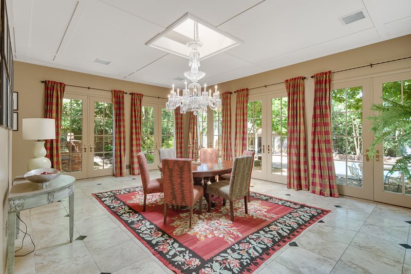 388 South Shady Grove Road Memphis, TN 38120 - Photo 21 of 25 The chandelier was purchased in New Orleans over 80 years ago by the Seller's family. Positioned under the skylight, it makes quite a statement and is beautiful in the evening. Note the french doors on 3 walls with majestic views at every turn!