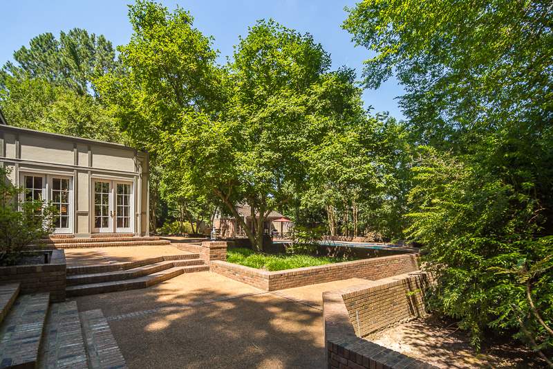 388 South Shady Grove Road Memphis, TN 38120 - Photo 25 of 25 The open, terraced patio spaces with multiple entry points from the home allow for great flow for entertaining. Ideal for young children, teens, adults, and grandchildren - this home is truly unique and a delight to experience!