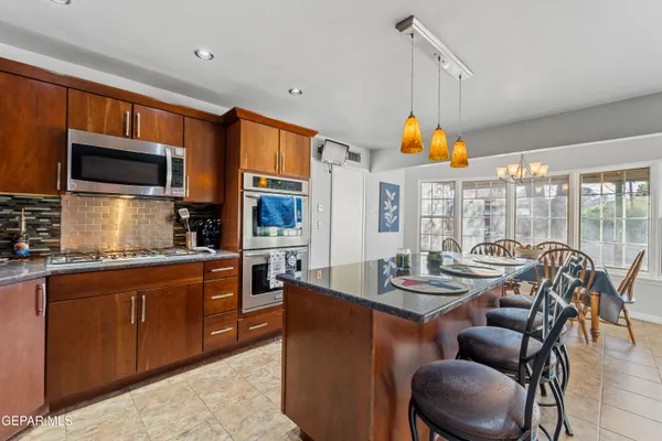 a dining room with furniture and window