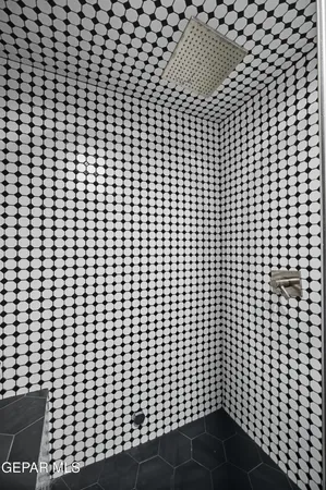 a room with furniture a table and white walls