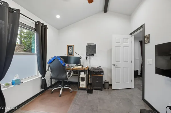 a view of an empty room with a fireplace