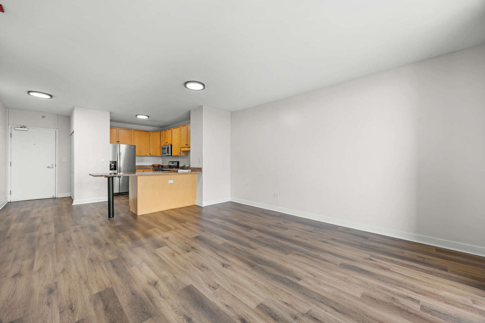 1101 South State Street, Unit 1805 Chicago, IL 60605 - Photo 6 of 21 a view of kitchen with wooden floor