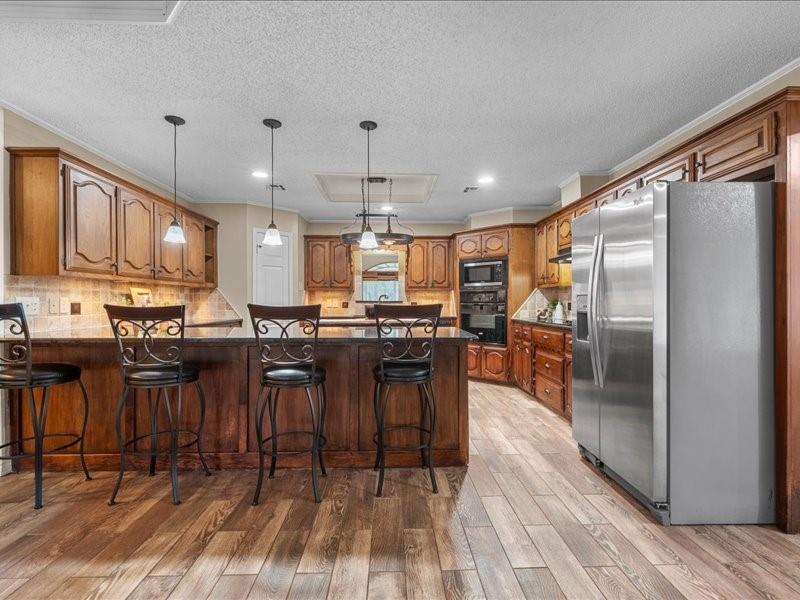 1072 Chapman Road Crawford, TX 76638 - Photo 7 of 39 a kitchen with counter top space cabinets and appliances
