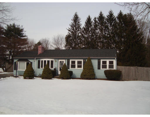 9 Wenzell Road Ashland, MA 01721 - Photo 1 of 1 a front view of house with yard and trees in the background