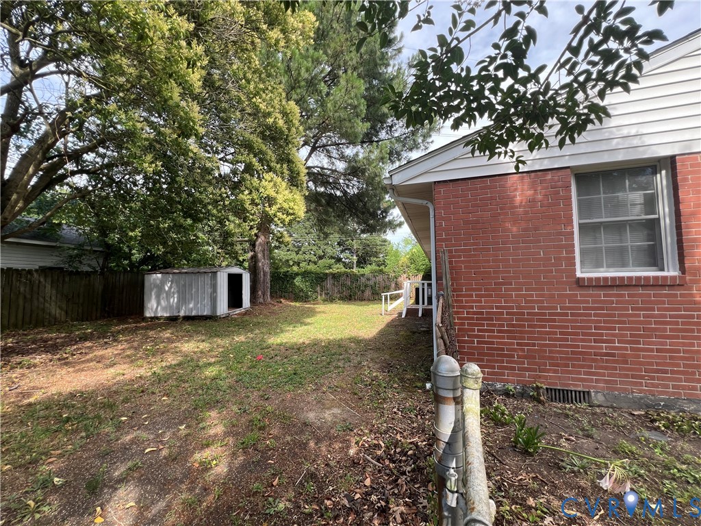 1403 Algona Road Chesapeake, VA 23324 - Photo 8 of 39 Spacious backyard featuring a storage shed, establ