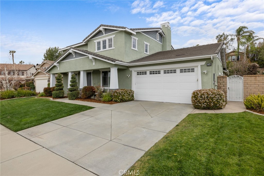 12348 Challendon Drive Rancho Cucamonga, CA 91739 - Photo 1 of 1 a front view of a house with a yard and garage