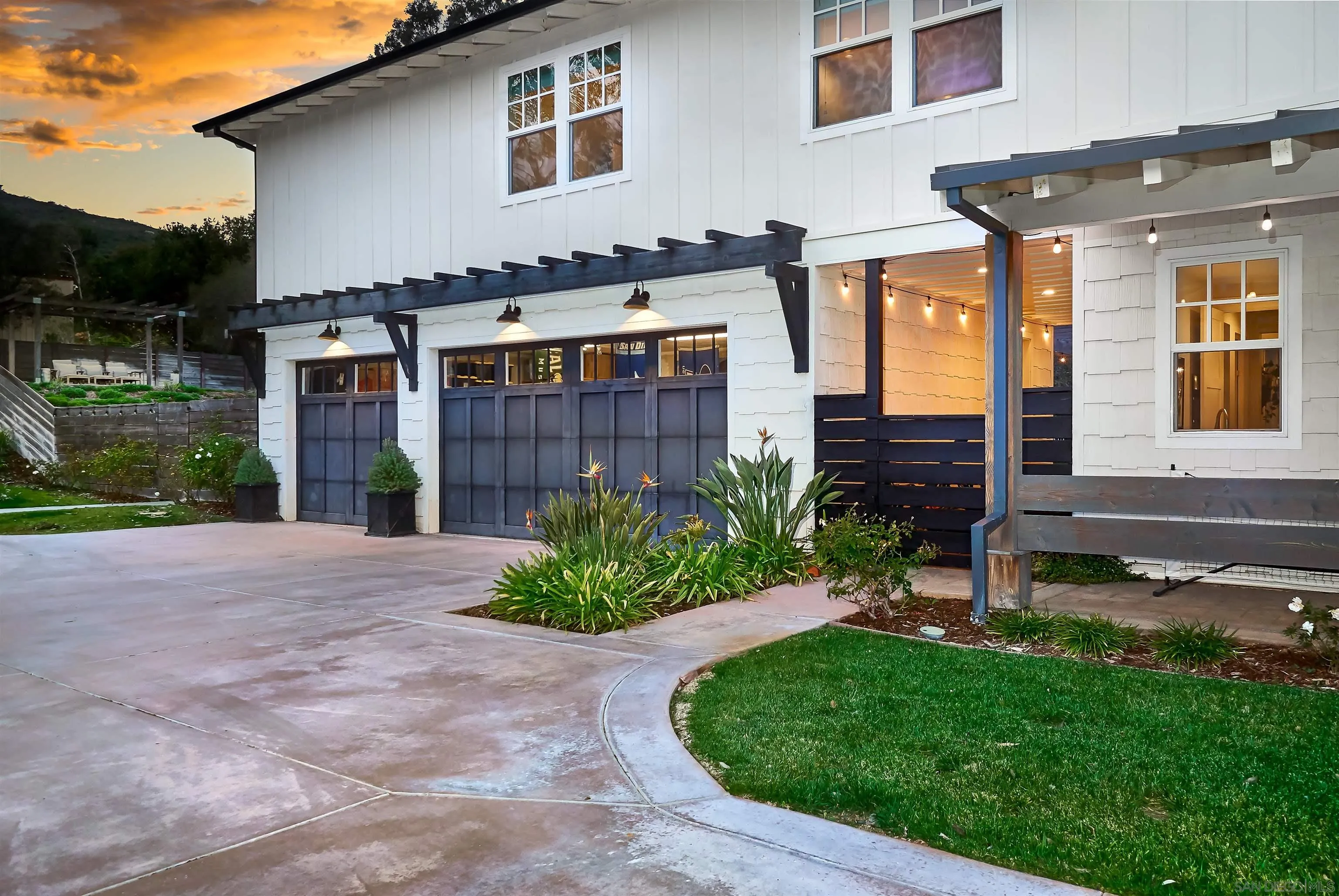 20104 Questhaven Road Elfin Forest, CA 92029 - Photo 11 of 33 a front view of a house with a yard and garage