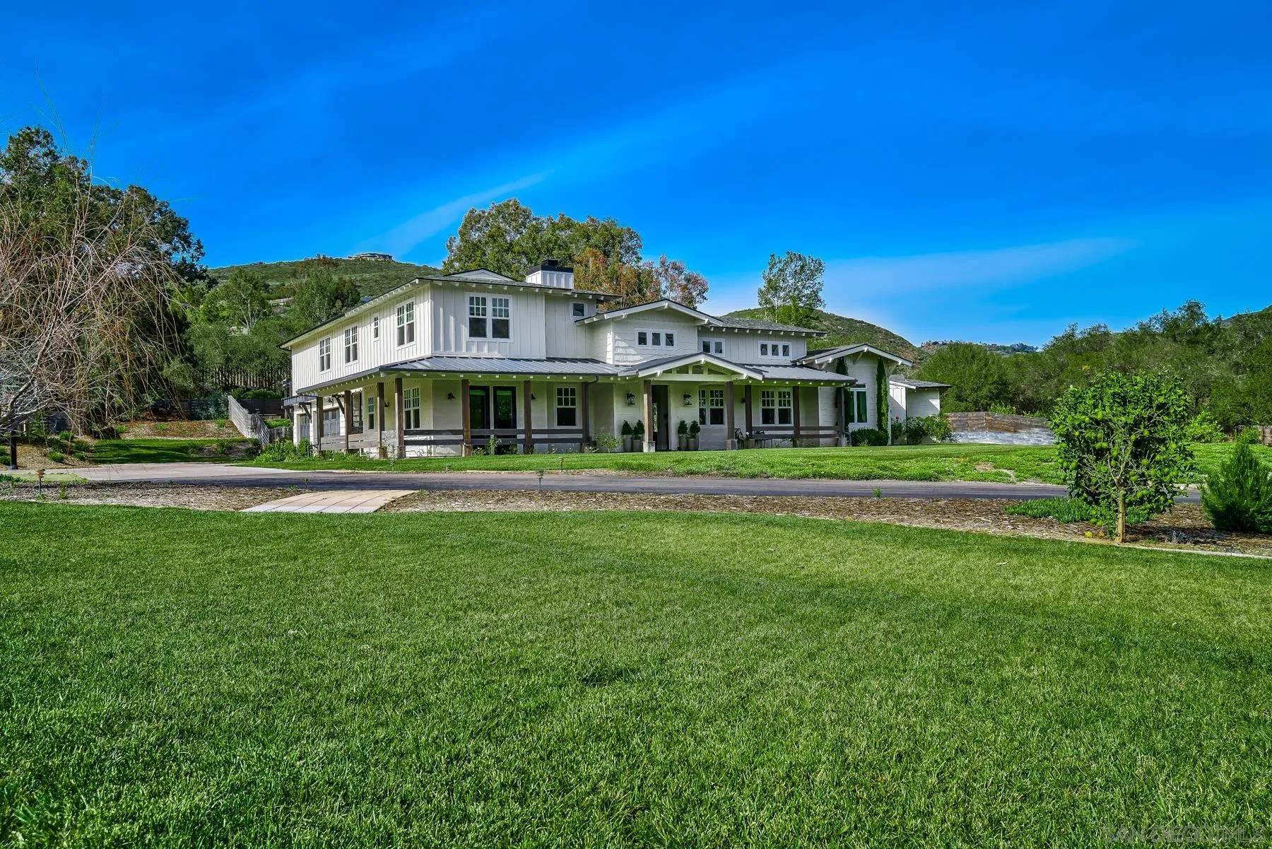 20104 Questhaven Road Elfin Forest, CA 92029 - Photo 12 of 33 a front view of a building with a garden
