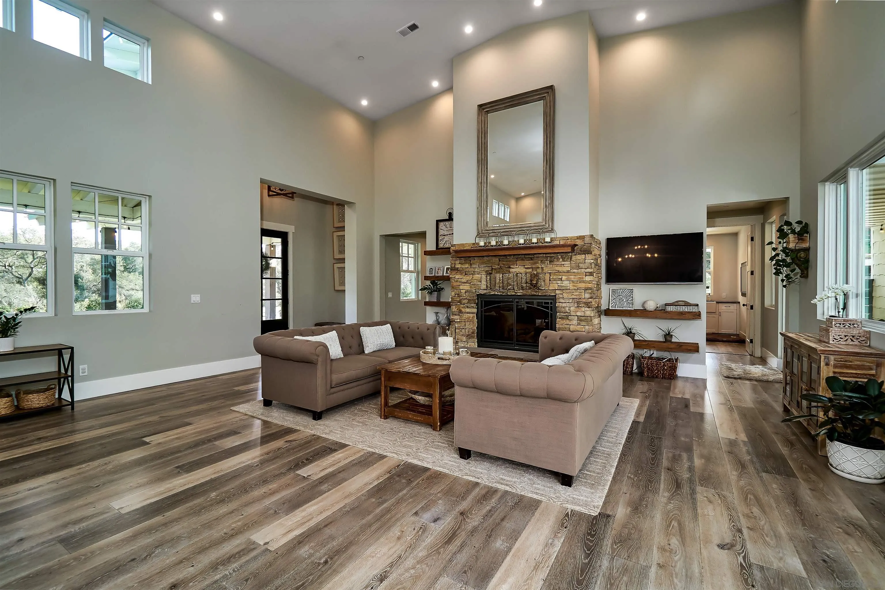 20104 Questhaven Road Elfin Forest, CA 92029 - Photo 14 of 33 a living room with furniture a fireplace and a flat screen tv