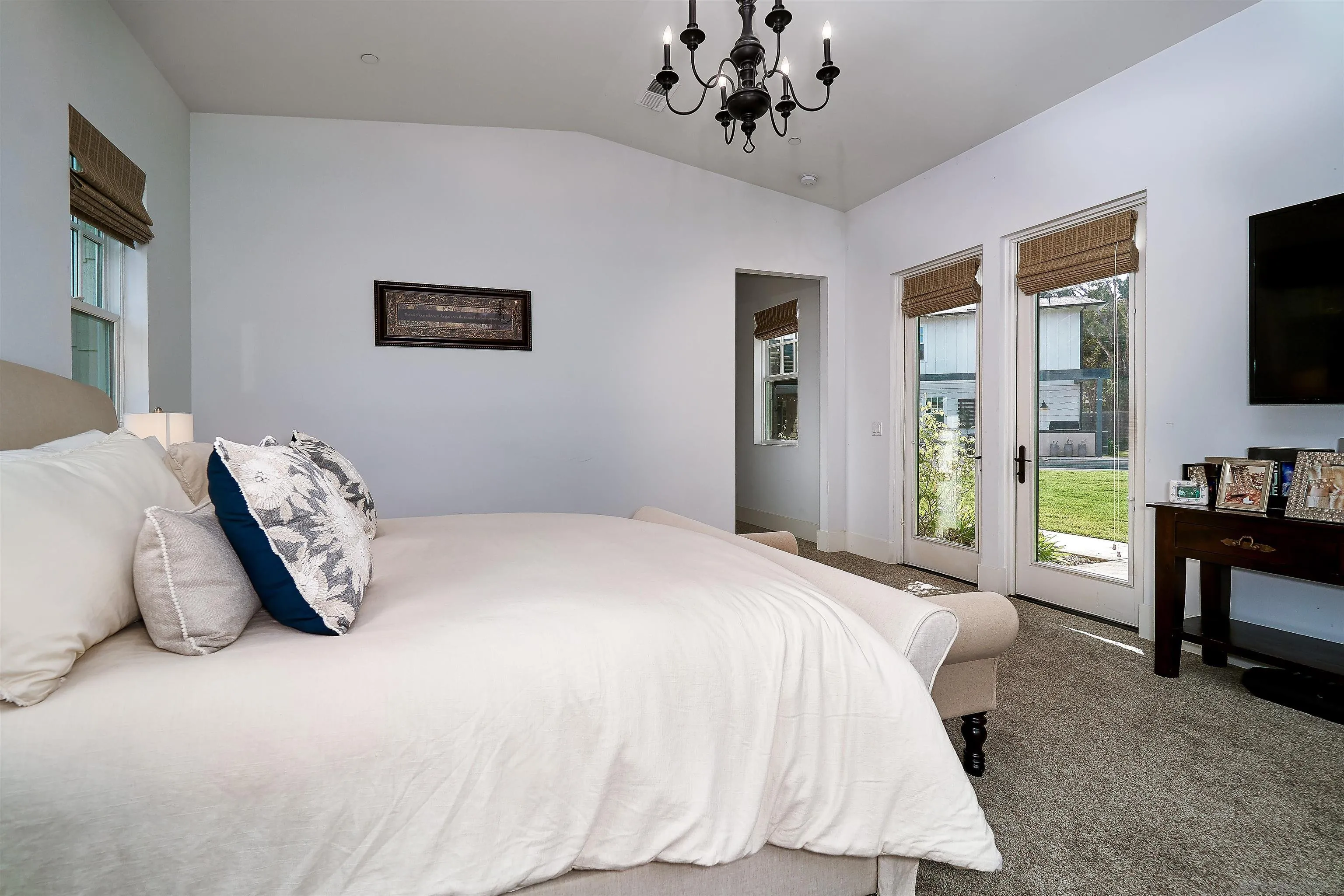 20104 Questhaven Road Elfin Forest, CA 92029 - Photo 20 of 33 a bedroom with a bed and a flat screen tv