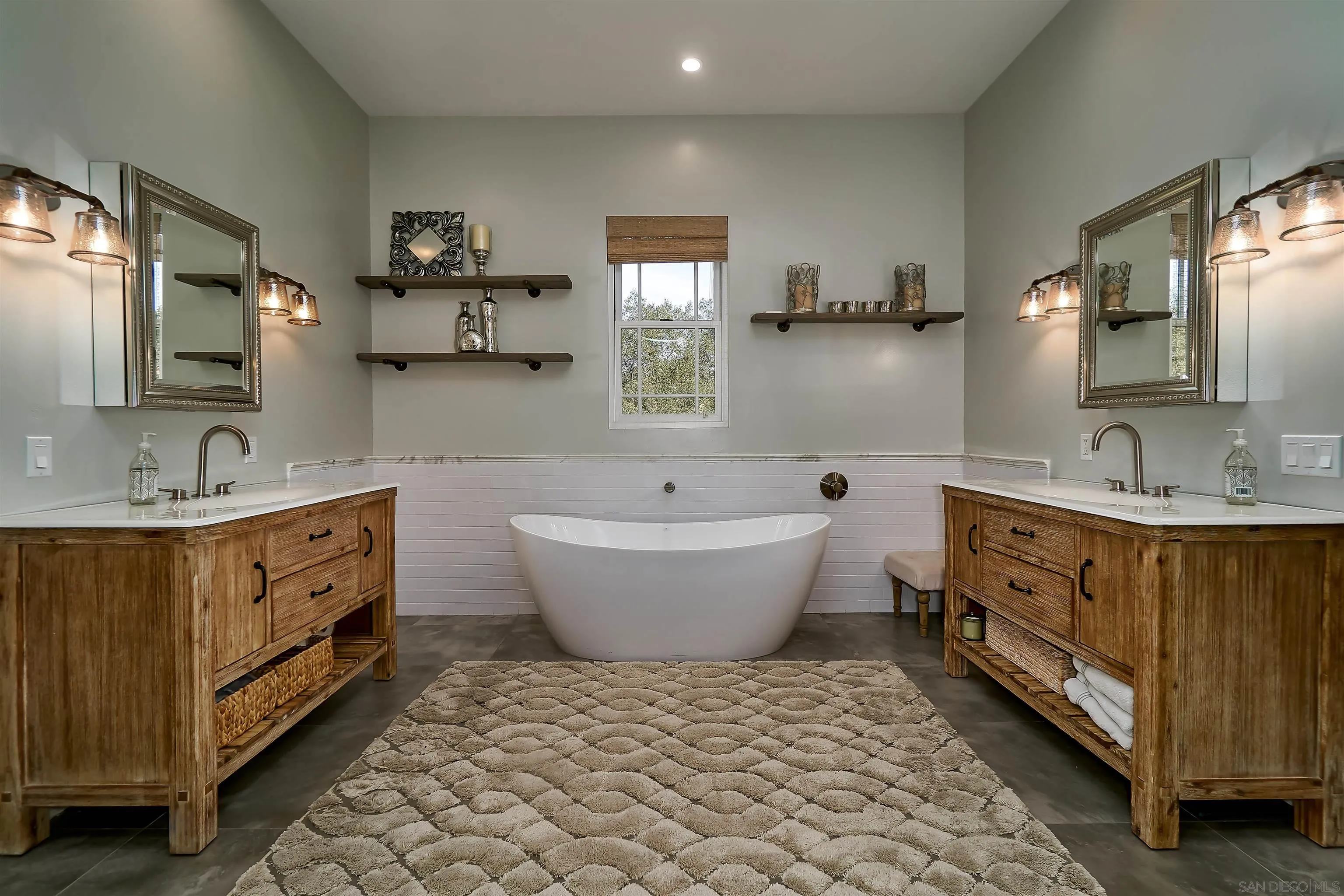20104 Questhaven Road Elfin Forest, CA 92029 - Photo 21 of 33 a spacious bathroom with a double vanity sink a mirror a bathtub and window