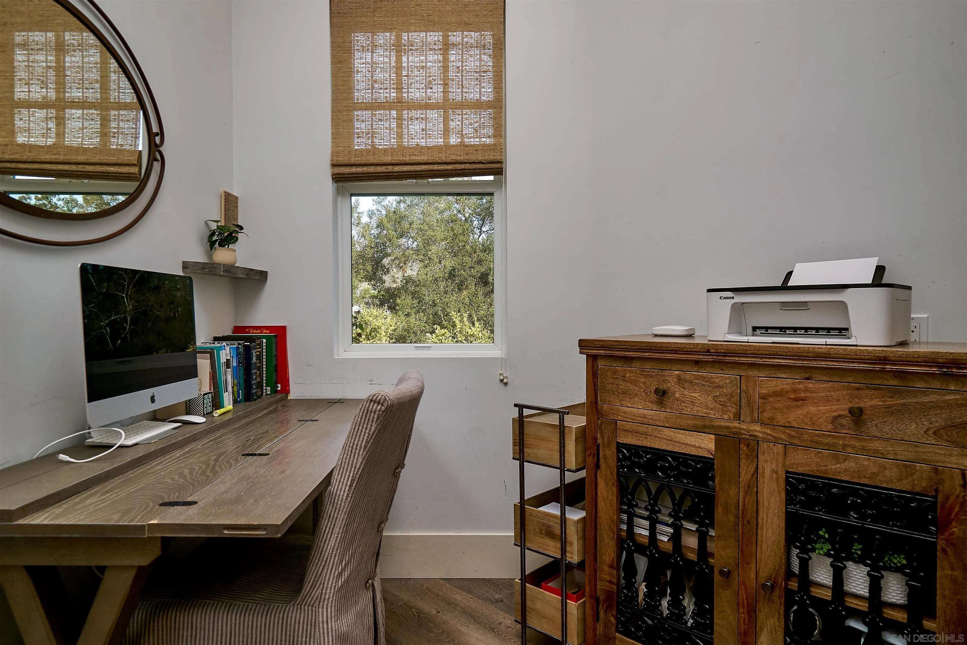 20104 Questhaven Road Elfin Forest, CA 92029 - Photo 23 of 33 a living room with furniture a flat screen tv and a fireplace