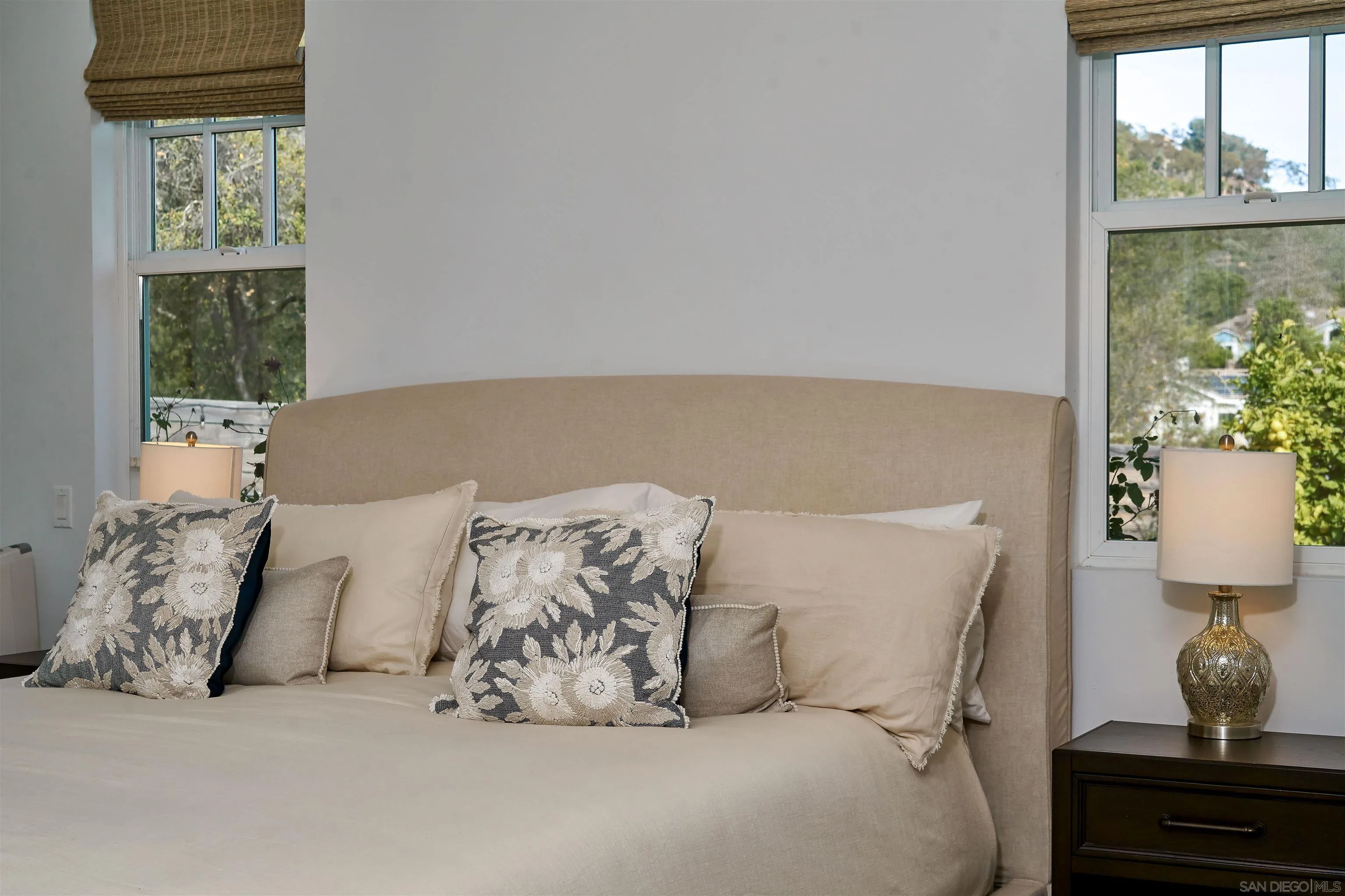 20104 Questhaven Road Elfin Forest, CA 92029 - Photo 24 of 33 a bed sitting in a bedroom next to a window