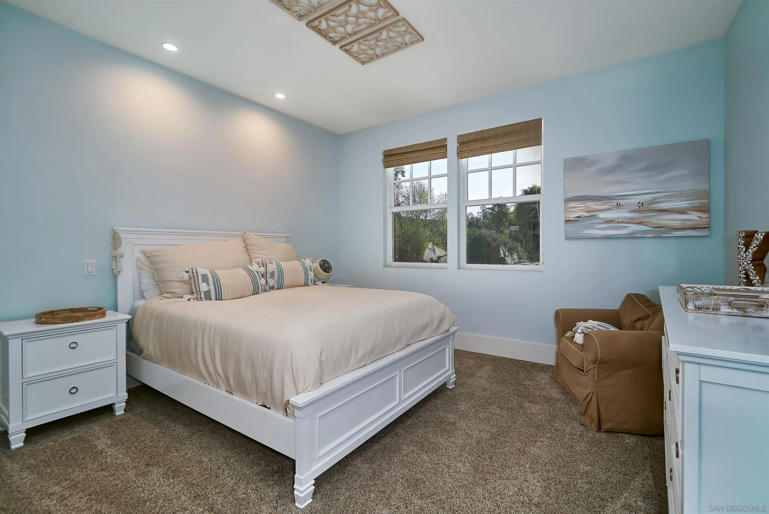 20104 Questhaven Road Elfin Forest, CA 92029 - Photo 25 of 33 a bedroom with a bed and window