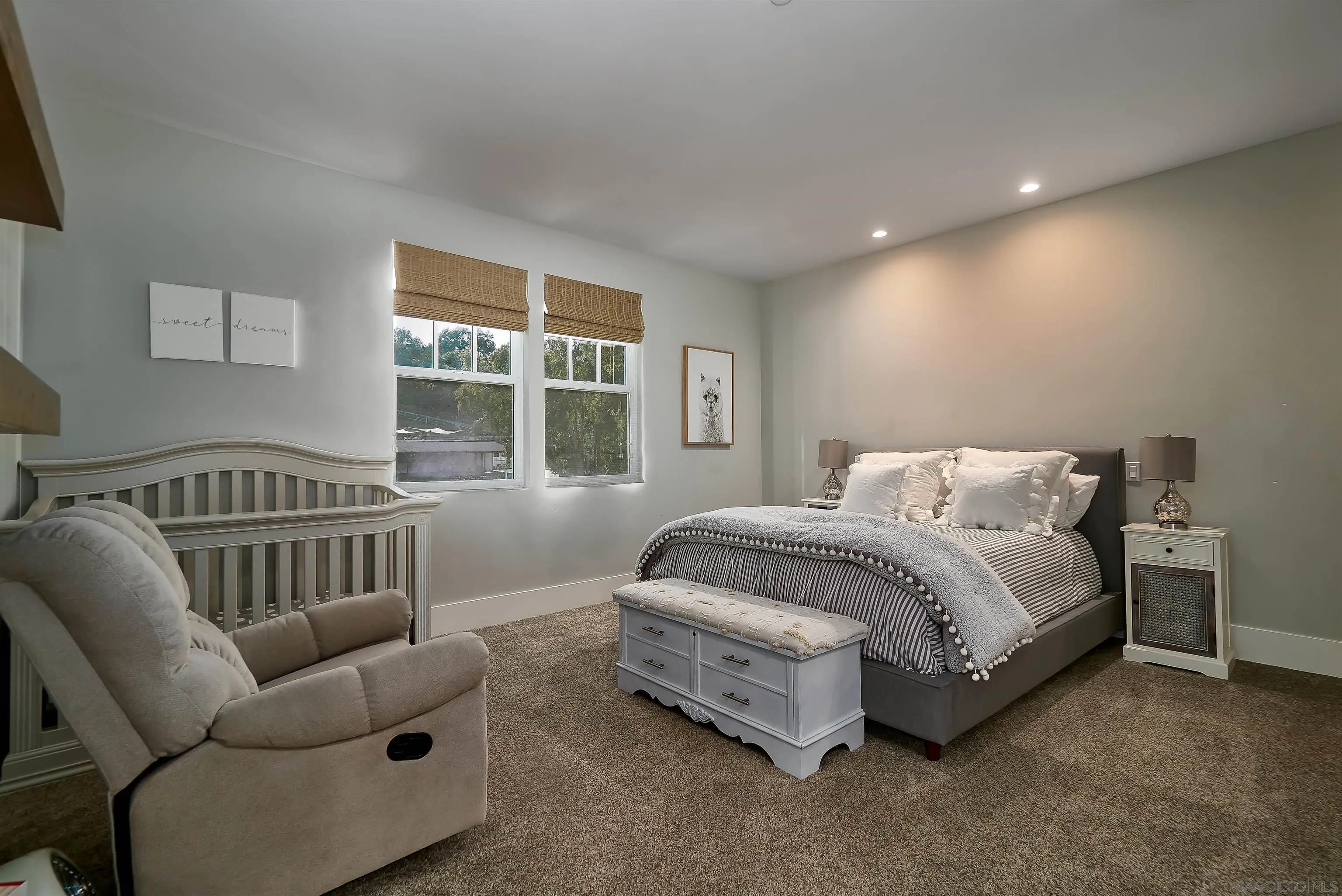 20104 Questhaven Road Elfin Forest, CA 92029 - Photo 26 of 33 a spacious bedroom with a bed and a couch