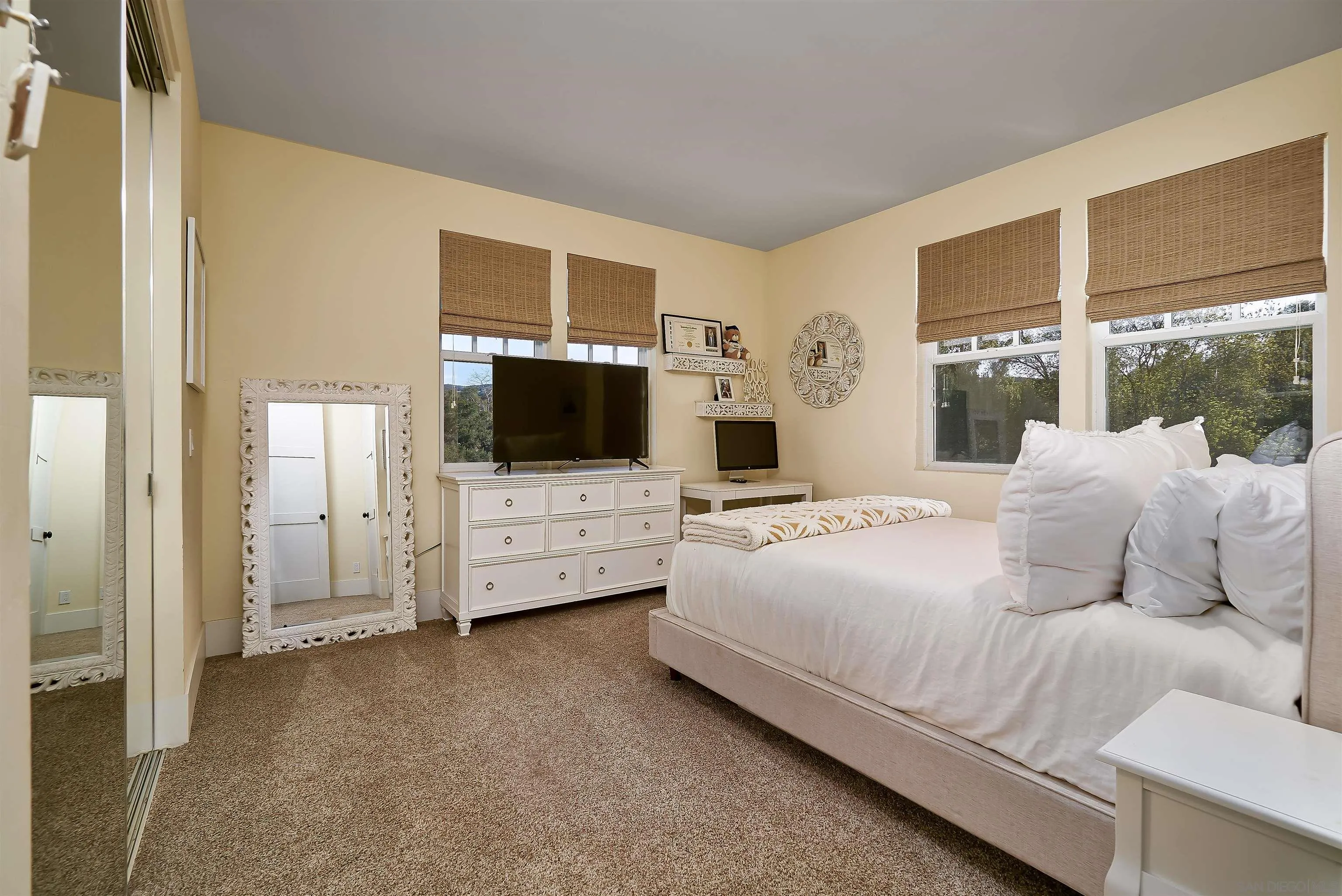 20104 Questhaven Road Elfin Forest, CA 92029 - Photo 27 of 33 a bedroom with bed and a flat screen tv
