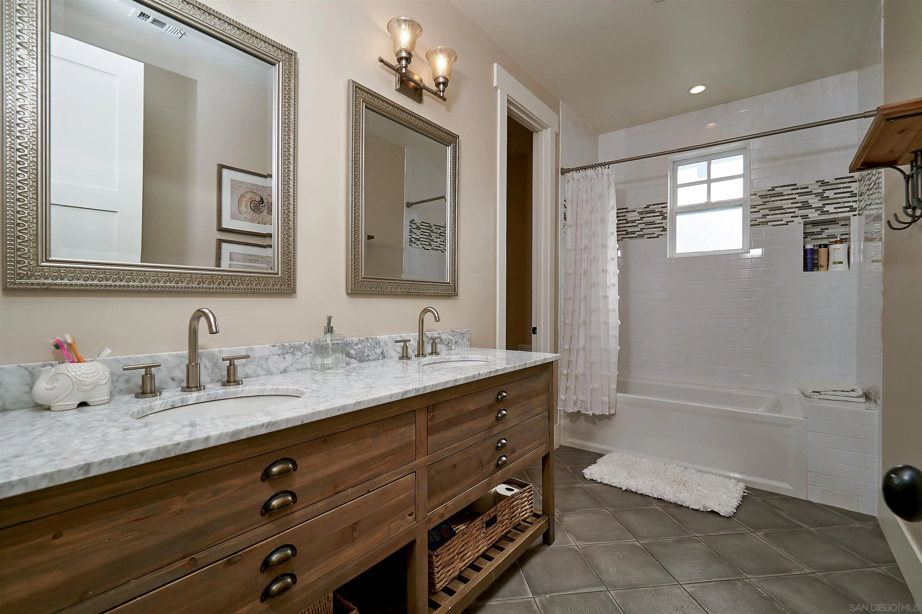 20104 Questhaven Road Elfin Forest, CA 92029 - Photo 28 of 33 a bathroom with a granite countertop sink a mirror and a bathtub