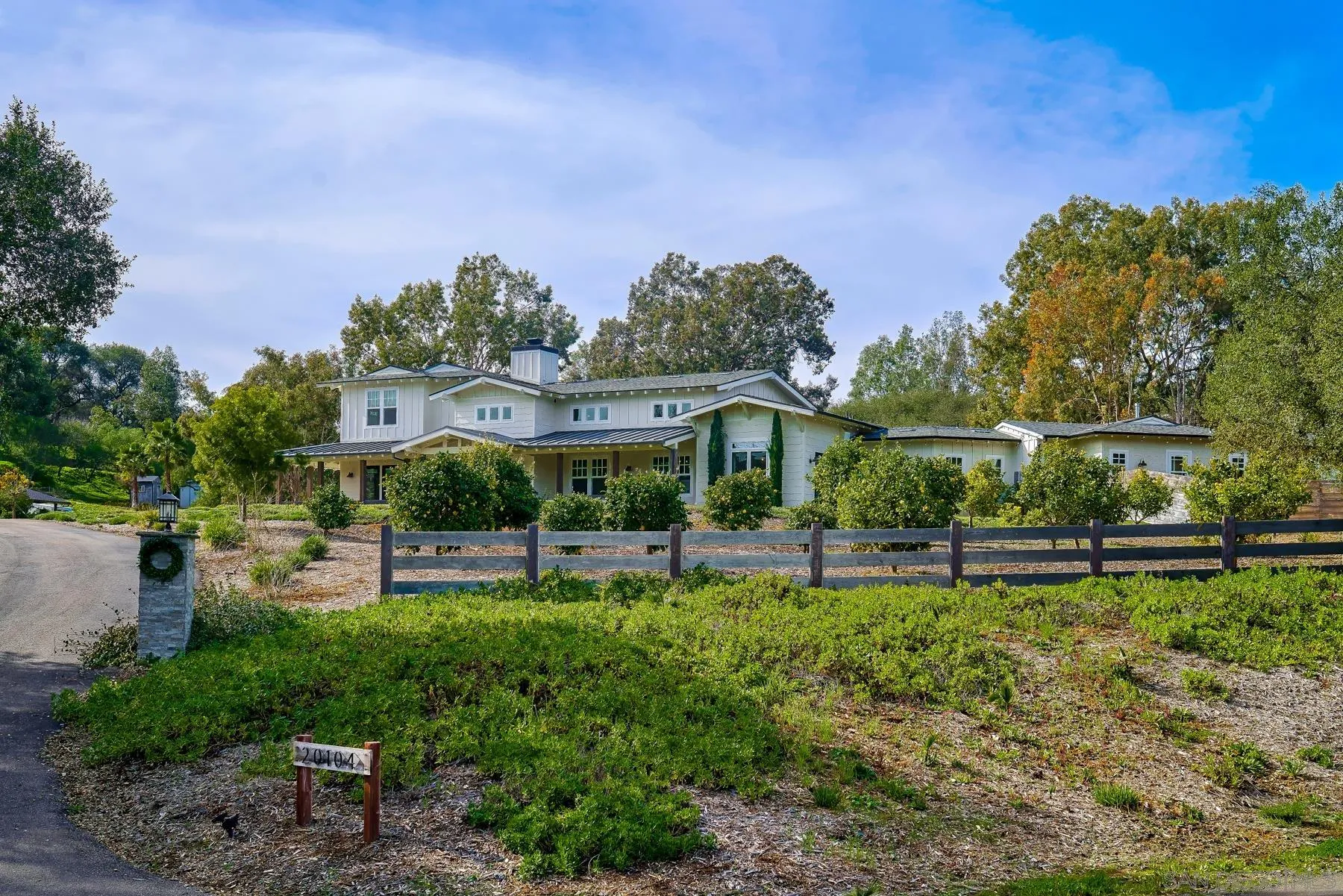 20104 Questhaven Road Elfin Forest, CA 92029 - Photo 31 of 33 a view of a big yard with table and chairs under an umbrella